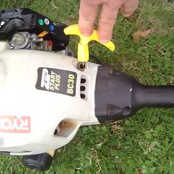 Ryobi BC30 30cc gas-powered straight-shaft brush cutter/string trimmer, featuring a two-cycle engine and a detachable head. Runs great