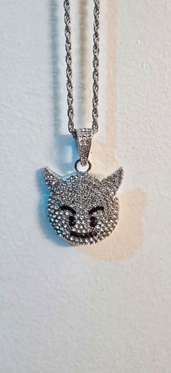 iced-out silver-tone devil emoji pendant on a 24" necklace