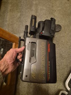 Panasonic video camera with charger and case
