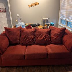 2 Red Couches And An Ottoman