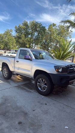 toyota tacoma light gray truck