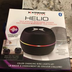 Black round colored bluetooth speaker