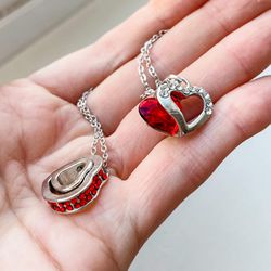 Two silver necklaces with red gemstones