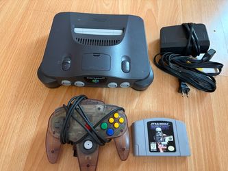 Nintendo 64 console with atomic purple controller game