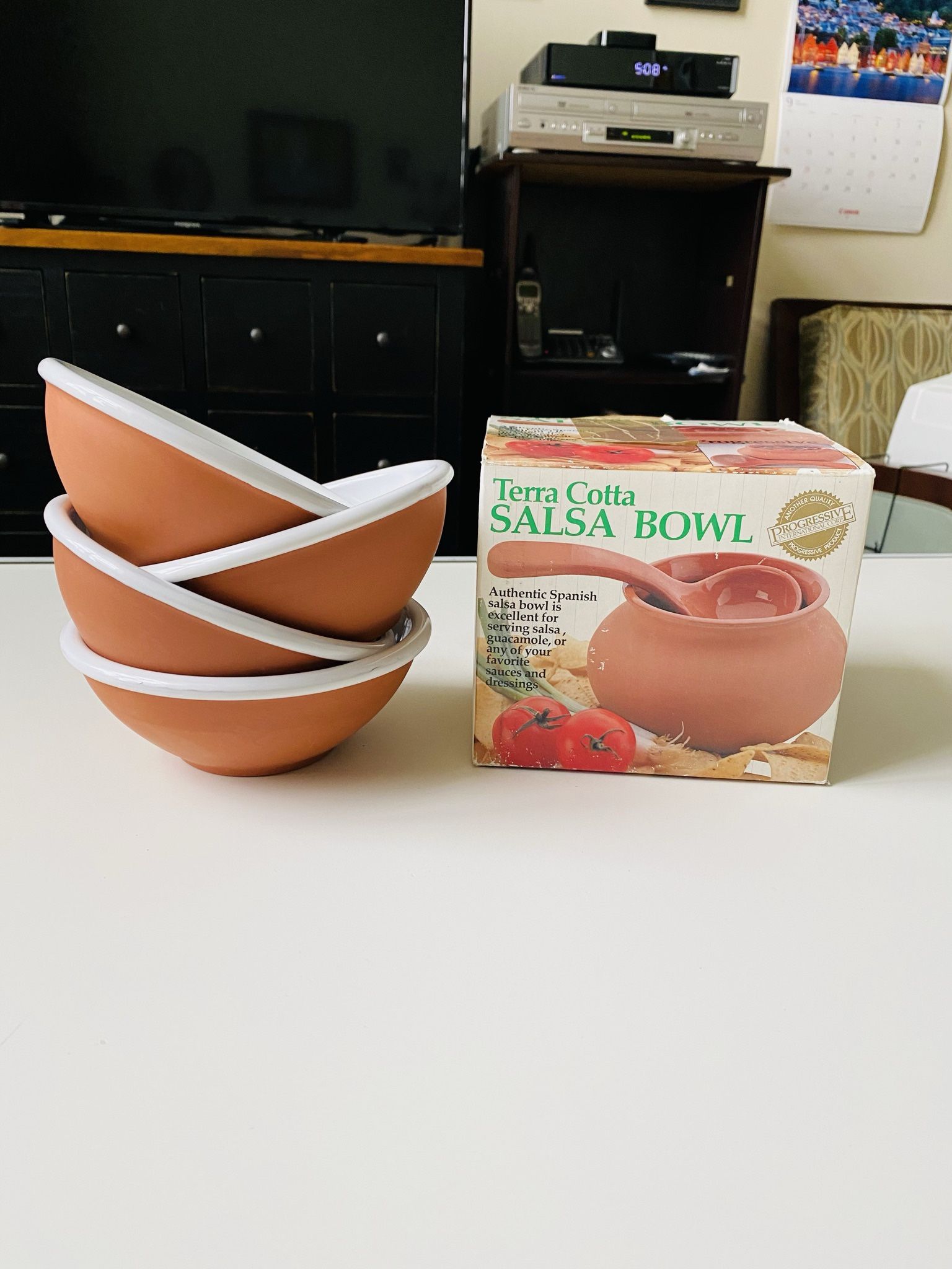 4 Terra Cotta Bowls. White Glazed inside and Natural Finish outside. Brand new. Never used. 6” in diameter. And Terra Cotta Salsa Bowl with a Spoon. B