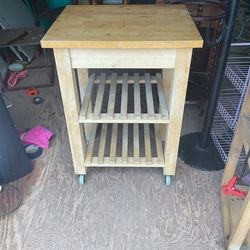 Nice rolling kitchen cabinet it’s 34 inches tall and 20 by 23 inches