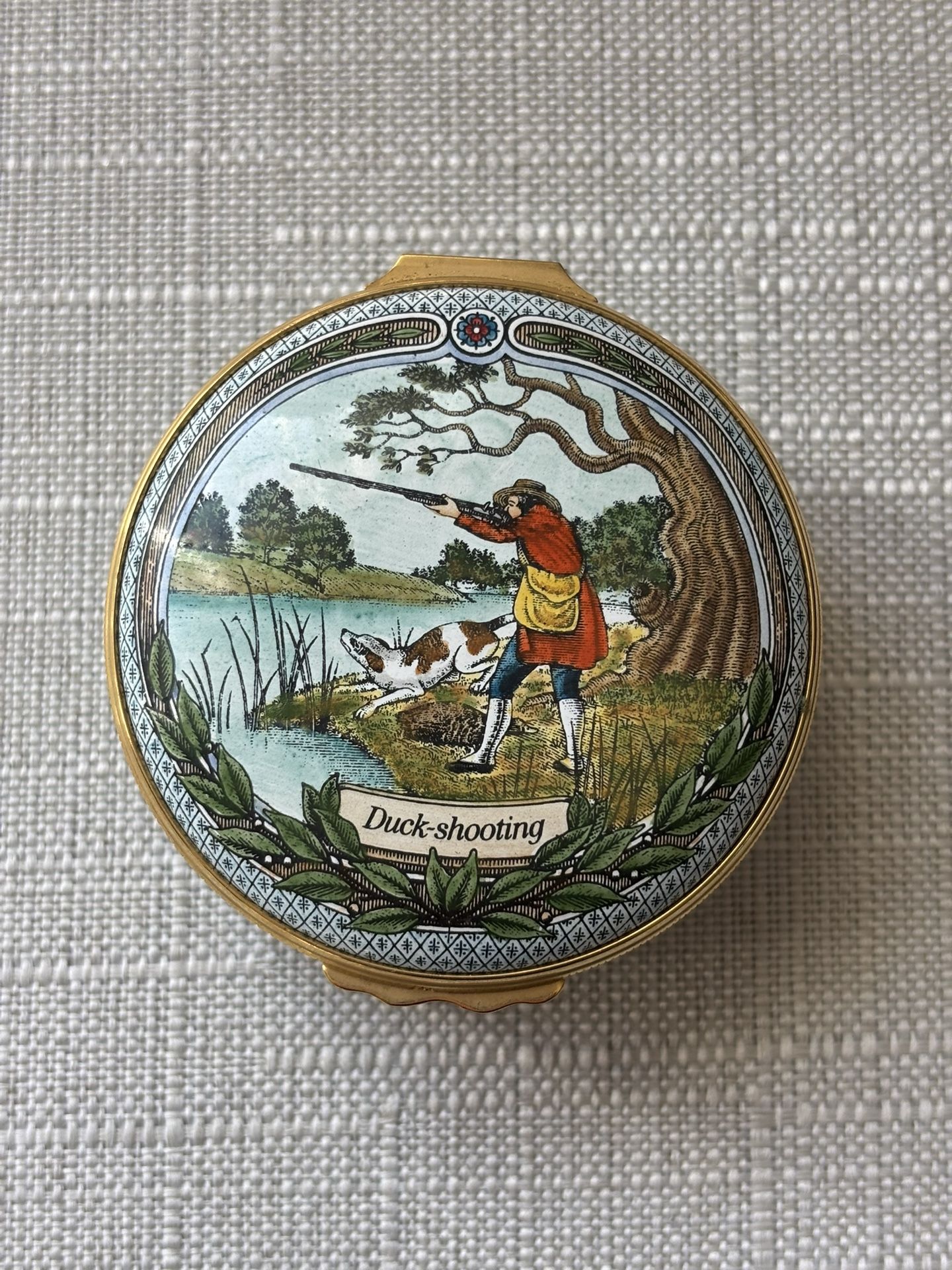 Halcyon Days enamel trinket box featuring a "Duck-shooting" scene.