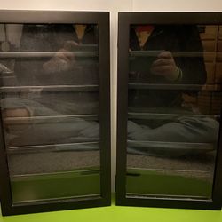 Black display cases with six shelves