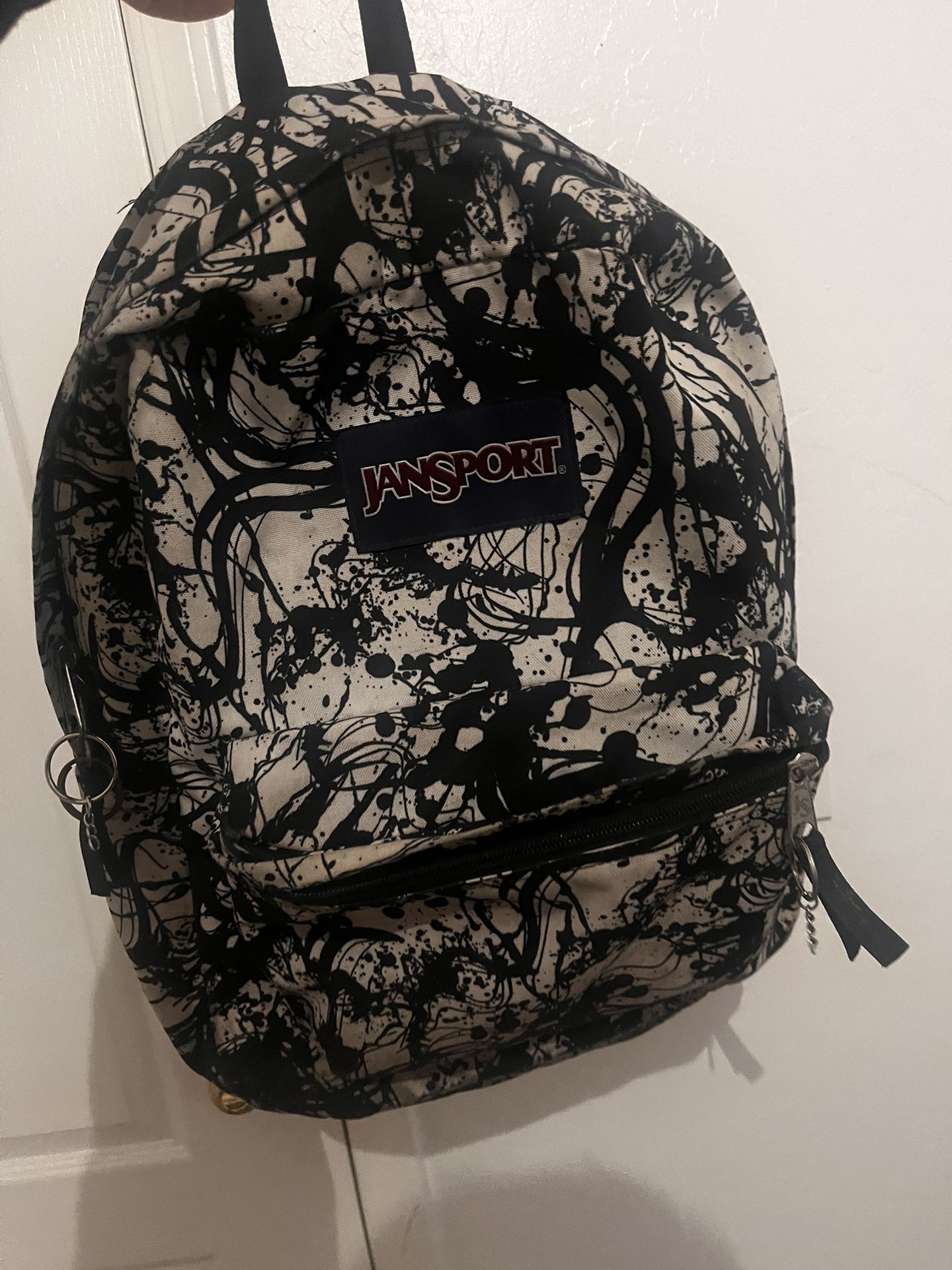 Jan’s Sport backpack, black, and white