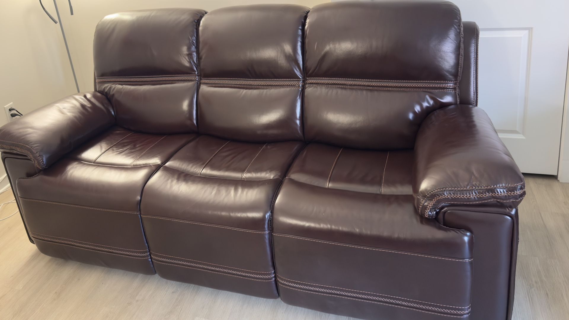 Selling a brand new Top-Grain Leather Power Reclining Sofa with Power Headrest from Raymour & Flanigan.