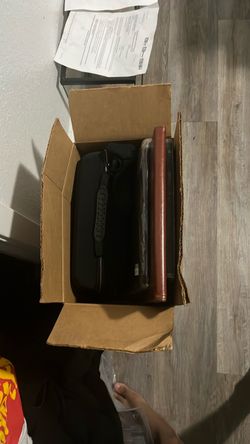 2 boxes of iPad cases and phones cases