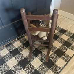 Old, brown, solid wood children’s rocker