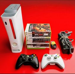 Microsoft Xbox 360 with 2 controllers 12 games HDMI cord power supply