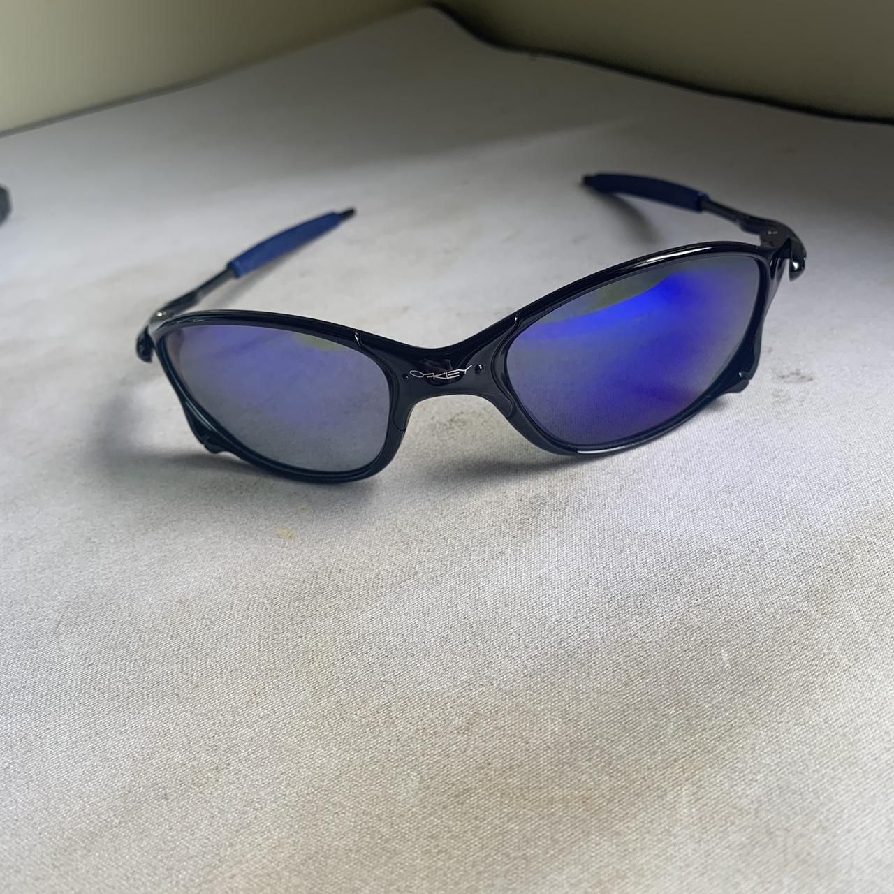 OakleyMen's Black and Blue Sunglasses(137)77