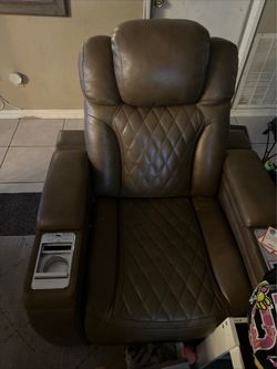 Reclining chair, used for gaming.