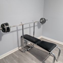 Weights bench w/barbell & 2x 45 lbs of weights