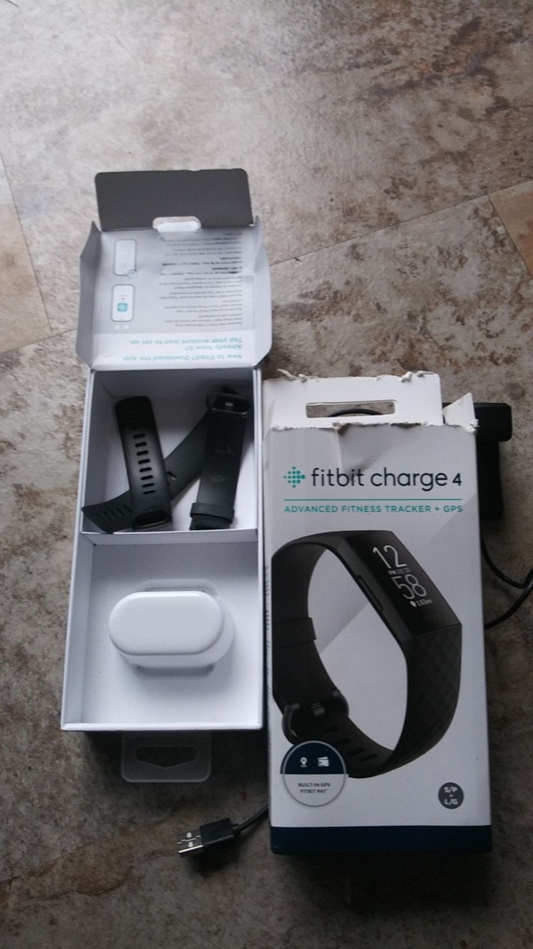 Fitbit charge 4 just out the box. Box is open but fitbit never used