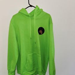 green hoodie with black graphic