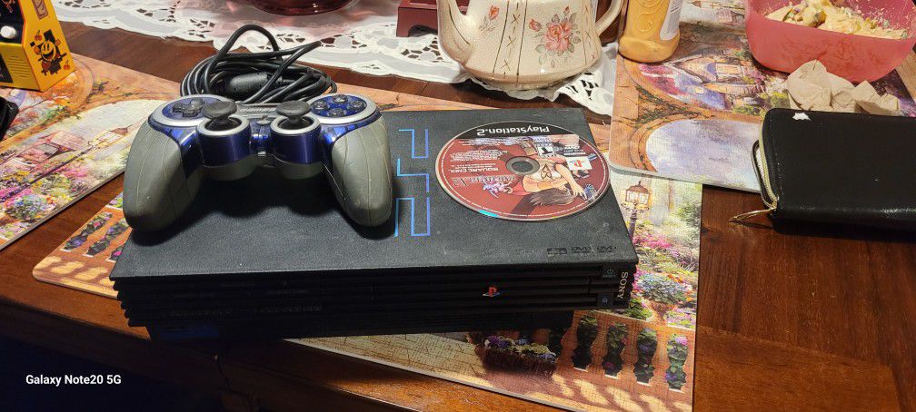 Ps2 And One controller and a game and cables