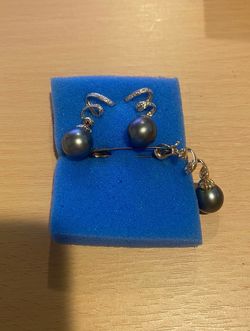 "14k with two dark gray diamond pearls and one diamond pearl pendant.