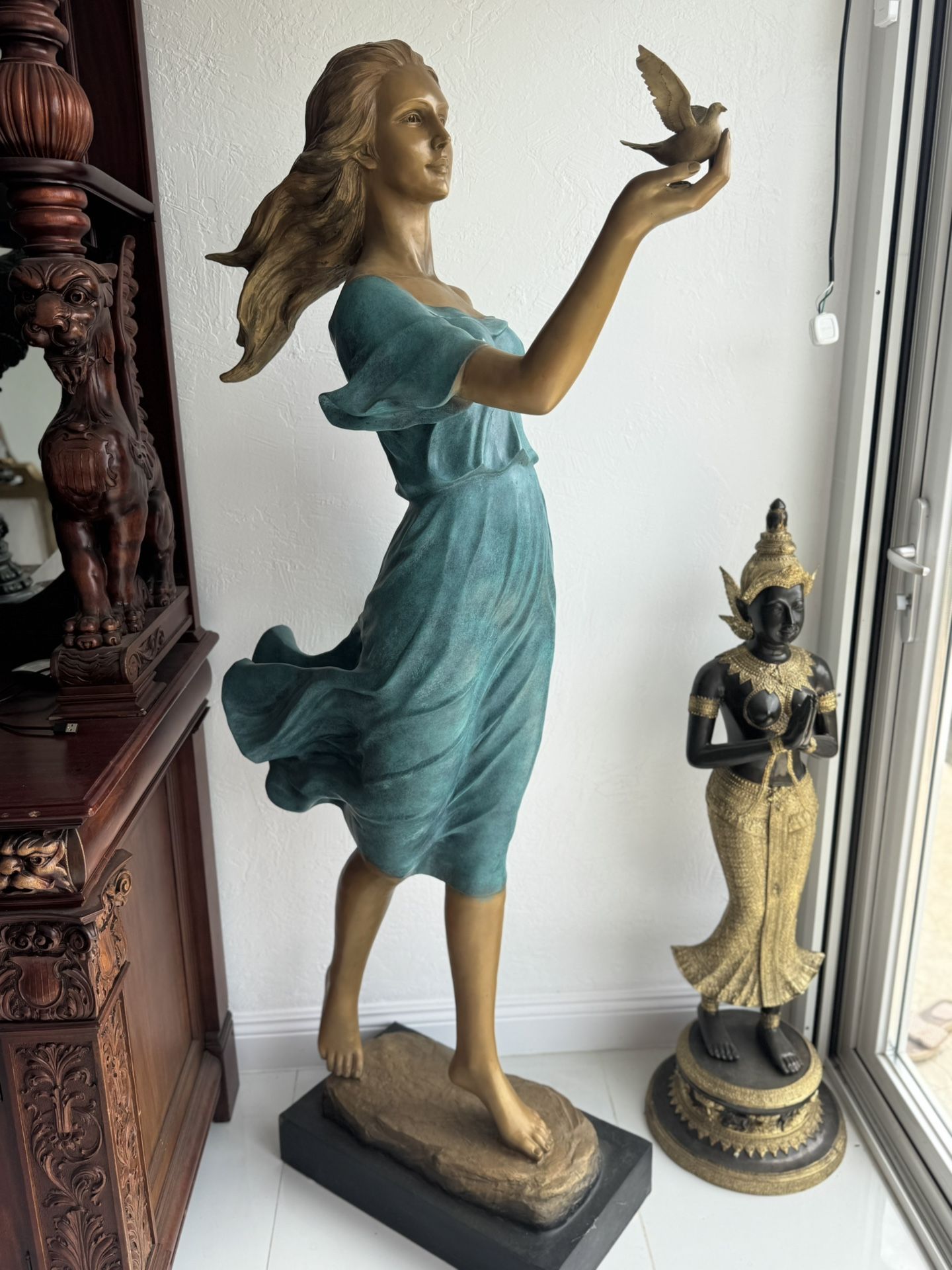 Life Size Woman with a Bird Bronze statue