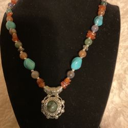 Tribal Necklace With Pendant ,and Multiple Gem Stones Including Torquise Stones.