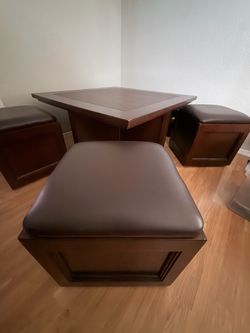 Wood coffee table with 4 roller chairs with storage