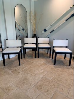 Set of four Restoration Hardware Saddle Fabric Dining Side Chairs. RH. White seat with black oak.