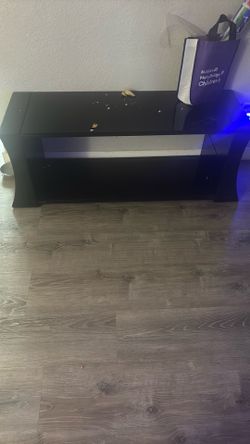 Tv stand with glass top and bottom