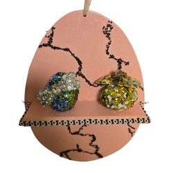 pink cracked Easter egg shaped shelf embellished with vtg jewelry