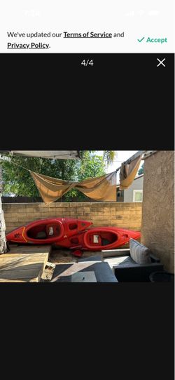 2 kayaks and paddles