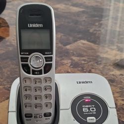 Uniden DECT1560 cordless phone with power cord and phone cord