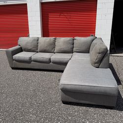 Grey L shaped 2 piece sectional couch