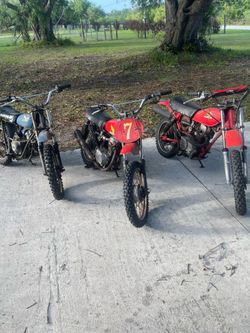 Three antique Honda dirt bikes