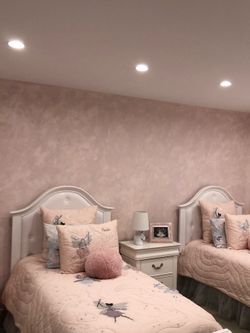 Two white twin beds