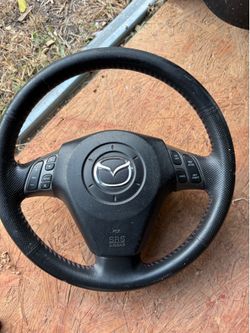 Steering wheel and air bag