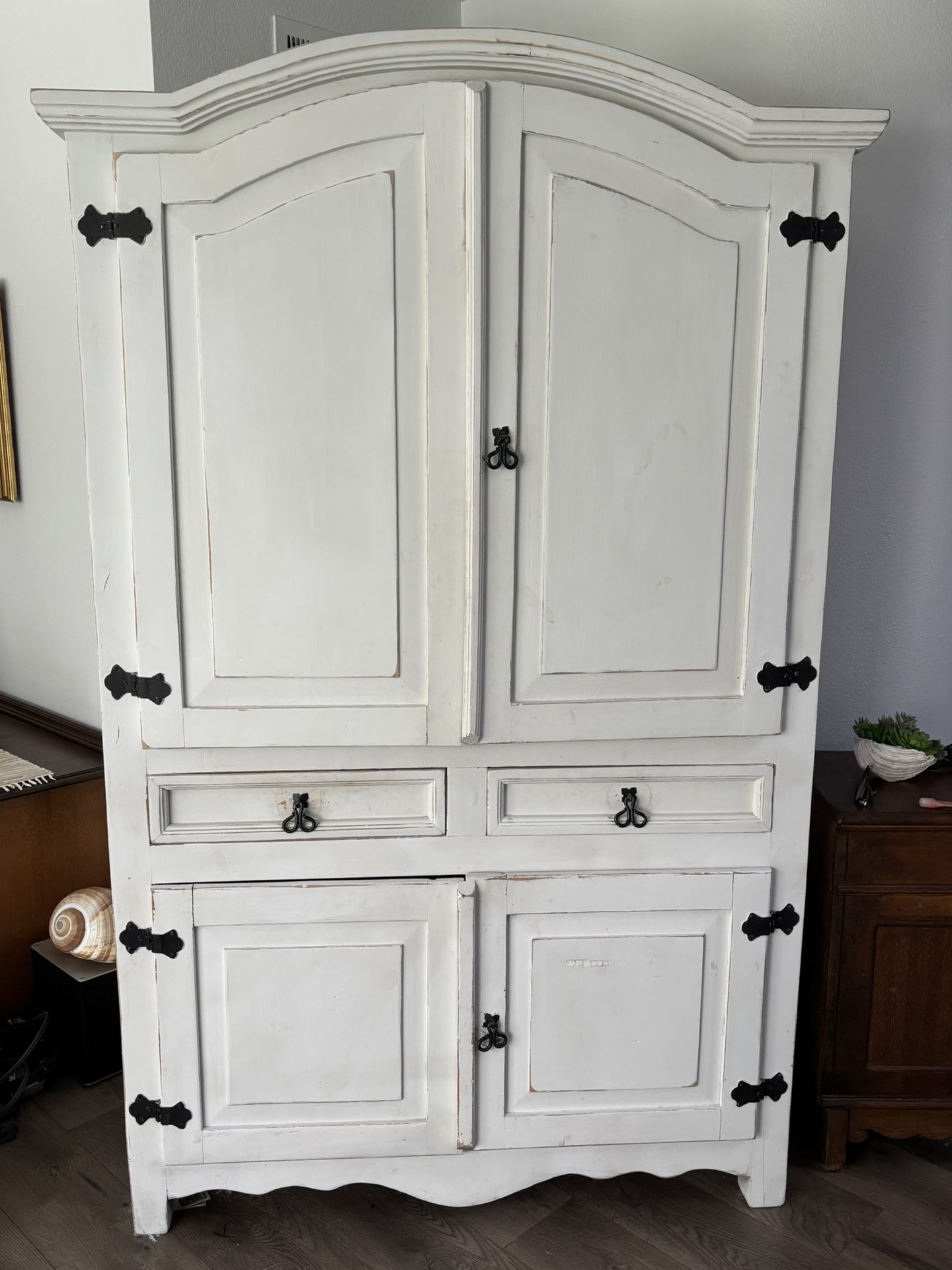 Deep Armoire with lots of storage, hanging rod & spacious drawers. Solid wood . A substantial piece for bedroom , family room or entrance!