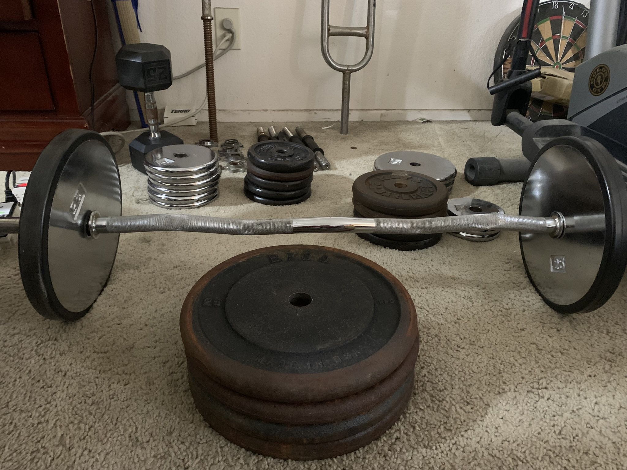Over 300 Lbs Of Gym Plates And Barbell