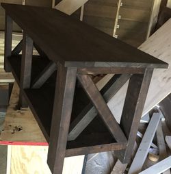 Freshly built Farmhouse style x-bench with storage area. Freshly built Farmhouse style x-bench with storage area. Dimensions are 54x16x20. Stained w