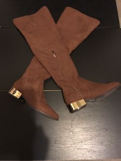 Brand new Suede knee high boots with gold heel. Size 7