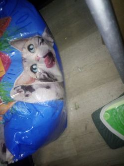 Friskies and meow mix half bags open