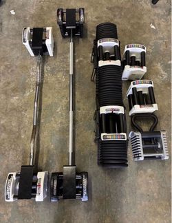 PowerBlock dumbbells 125 lbs plus attachments