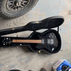 Electric Guitar And Case 