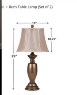 traditional-style Ashley Furniture Ruth table lamp with a dark, textured base and a beige fabric shade