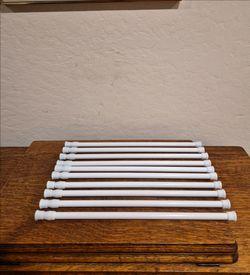 Set of 10 White Adjustable Spring Tension Curtain rods.
16" to 28.5"