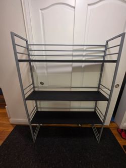 Gray metal and black shelf unit