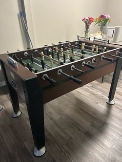Foosball Table with Black and Cream Players