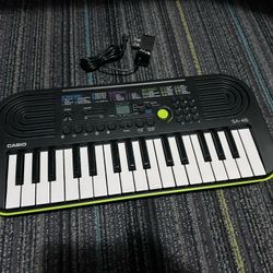 Casio SA-46 Mini Piano Keyboard, 10 Song Bank, 50 Patterns With Power Cable