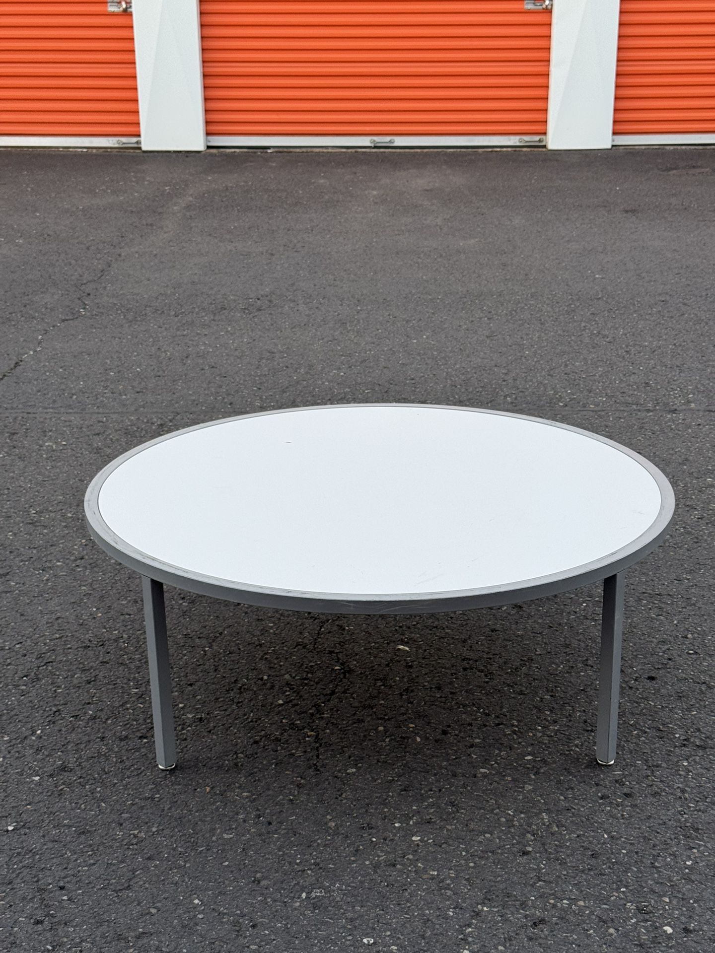 2000โs oversized silver and white coffee table