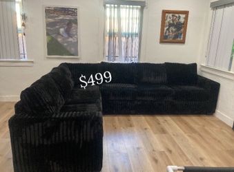 Large sectional sofa black fur- like jumbo corduroy